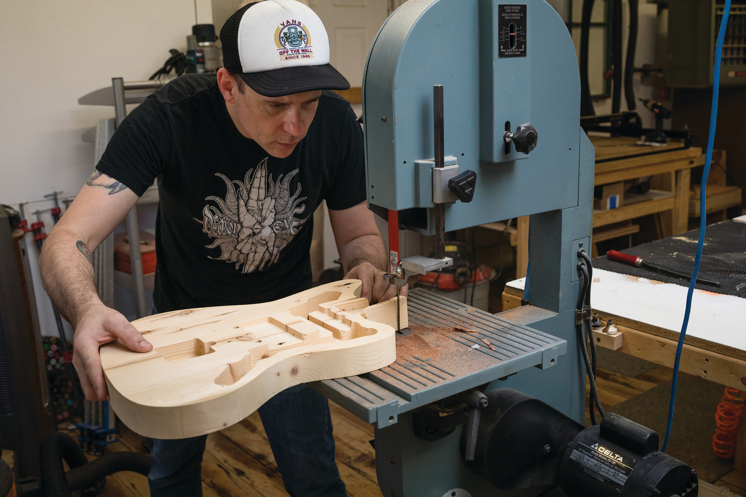 Bill Paukert, luthier and owner of Unified Guitar Works in Warren, creating a guitar from reclaimed wood.