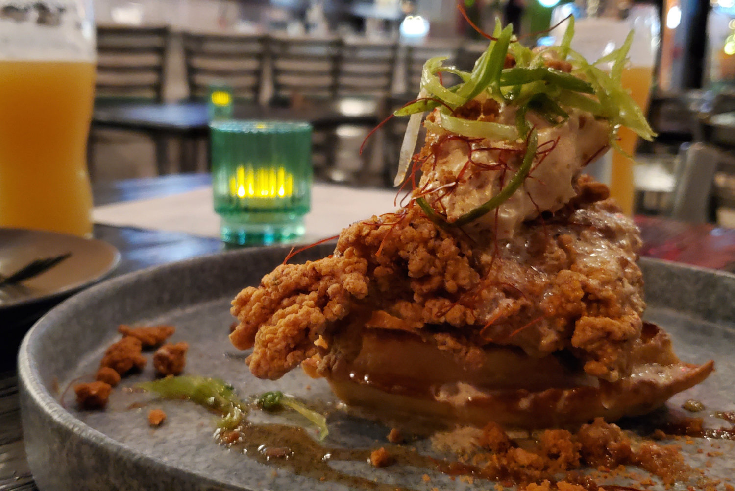 Chicken & Waffles topped with a dollop of brown sugar butter