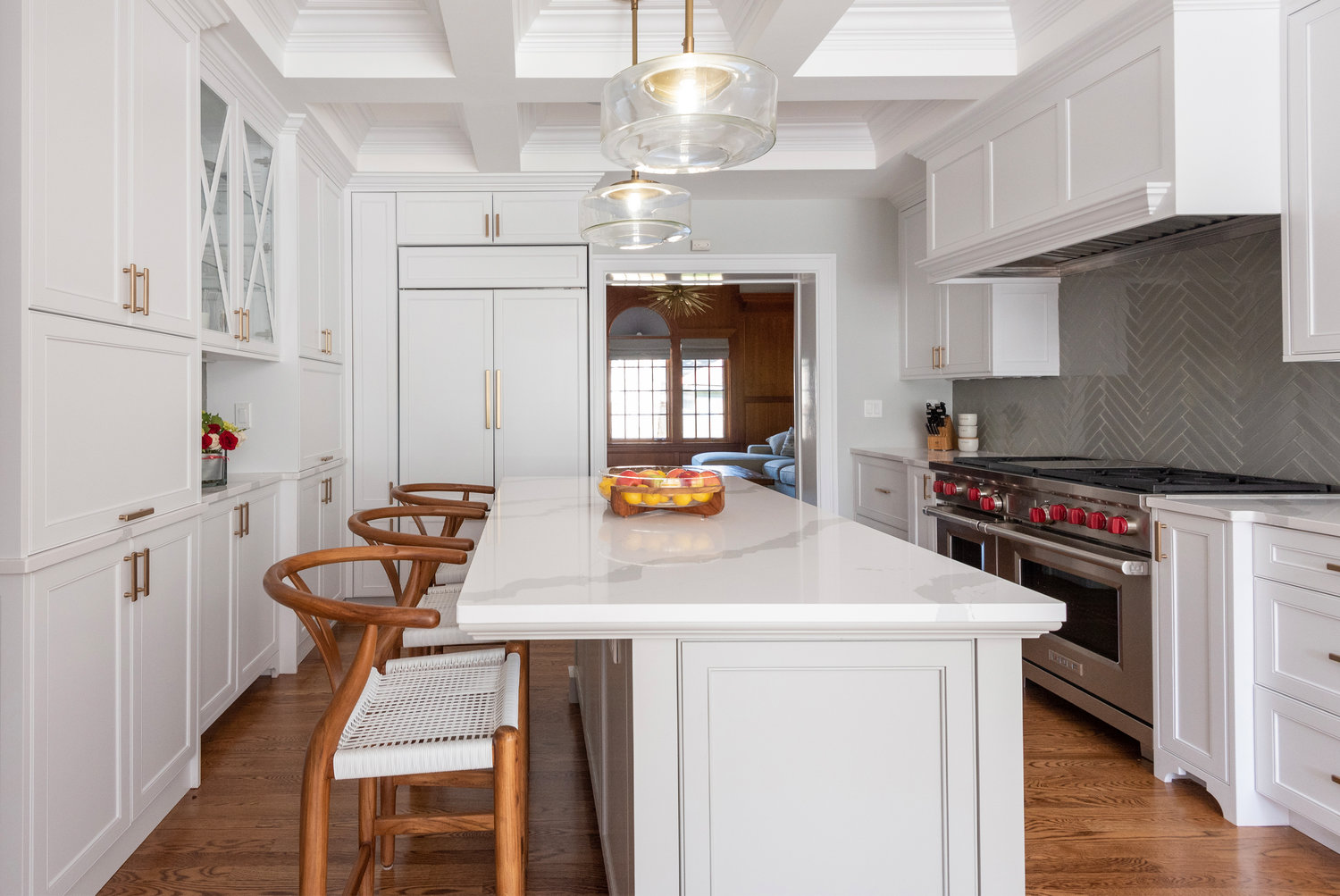 Metallic hardware shakes up traditional white cabinetry