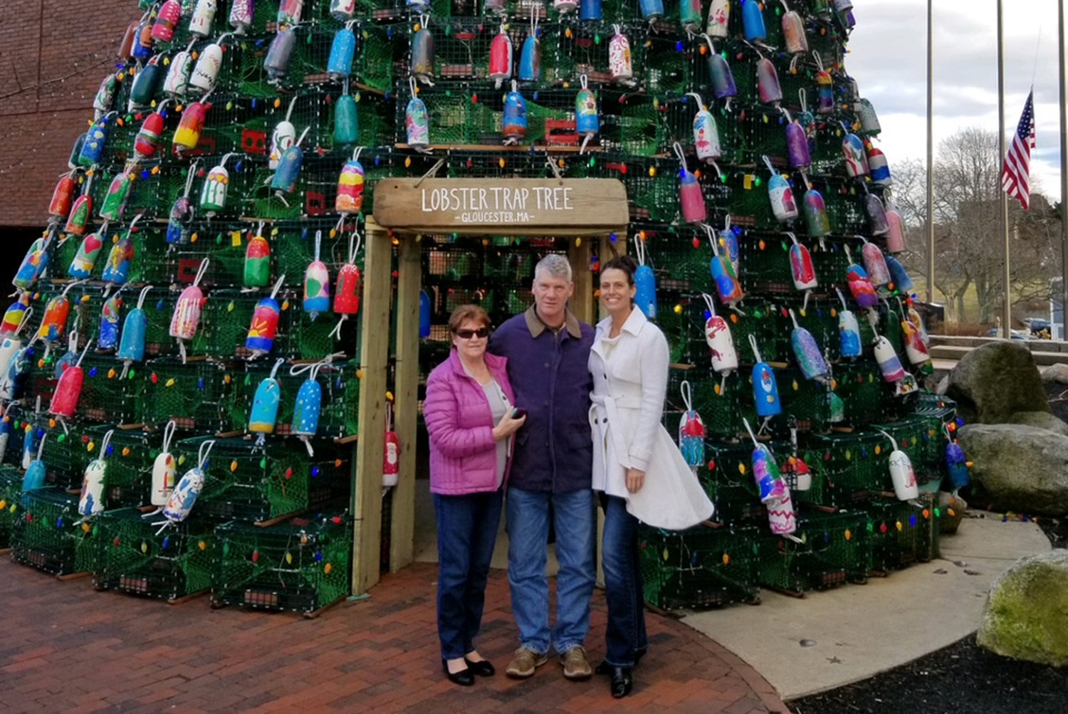 Doris Copponi, Tom Fabian, and Lisa Konicki find inspiration in Gloucester. “Their tree is covered entirely in buoys painted by children; ours has buoys from professional artists and 40 painted by Stonington children. The OCCC sent a $1,000 donation check to Cape Ann Arts which produced this tree as a ‘thank you’ for the inspiration,” says Konicki.