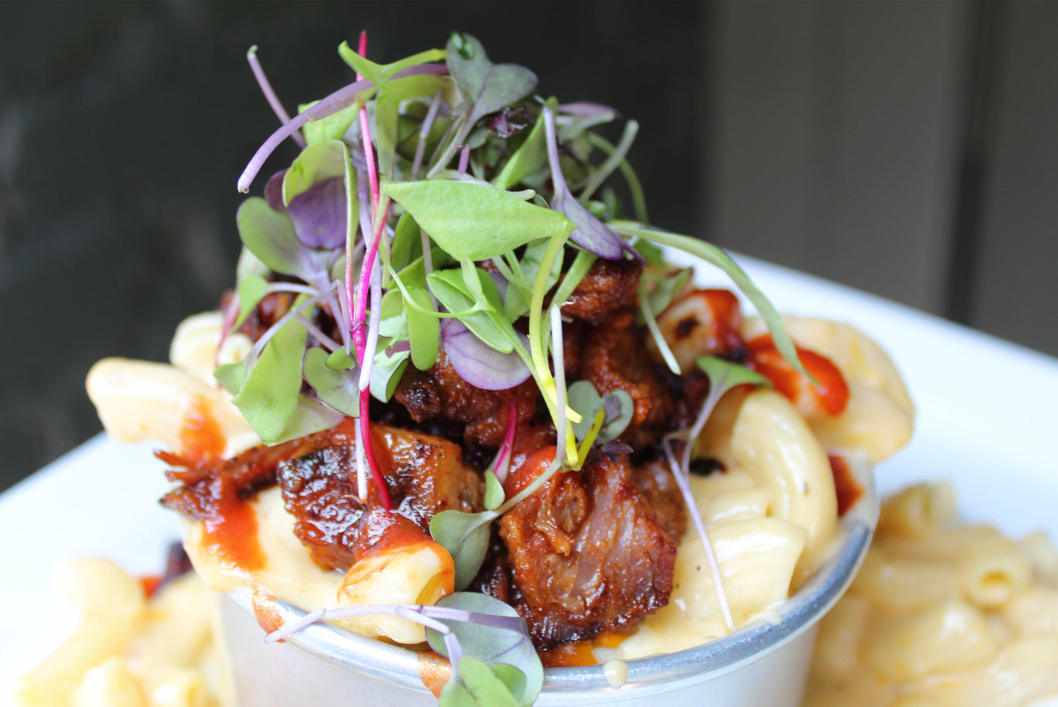 Pates elevates pub fare, like mac and cheese with brisket burnt ends