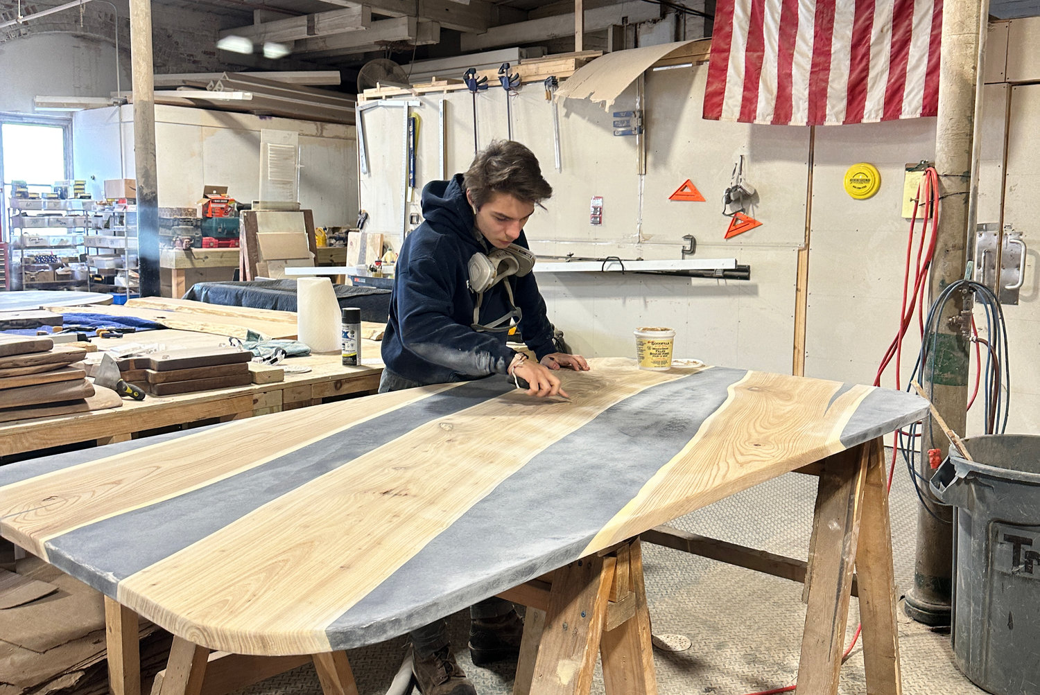 Nicholas Myette works on a table top