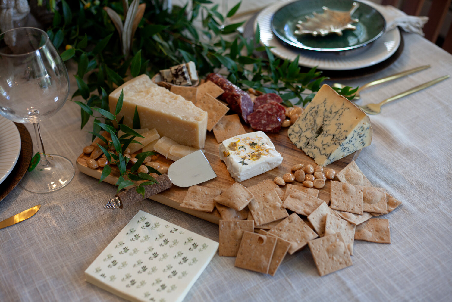 A cheese board topped with an artisanal array makes for a rustic and casual start to any gathering